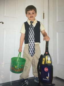 Dylan, dressed as a vacuum salesman, for Halloween